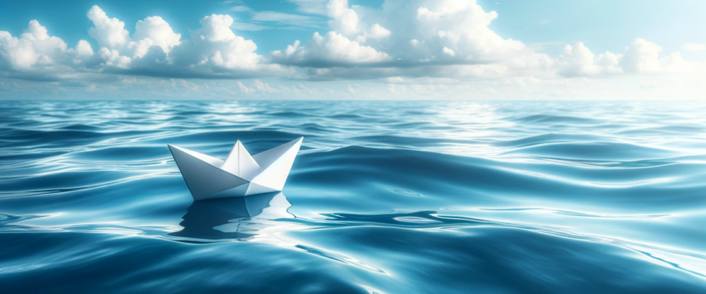 Freight Forwarding represented with a white paper boat on the ocean